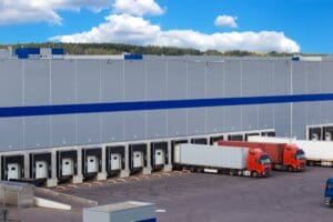 Aerial view of artic lorries being unloaded at a national distribution centre