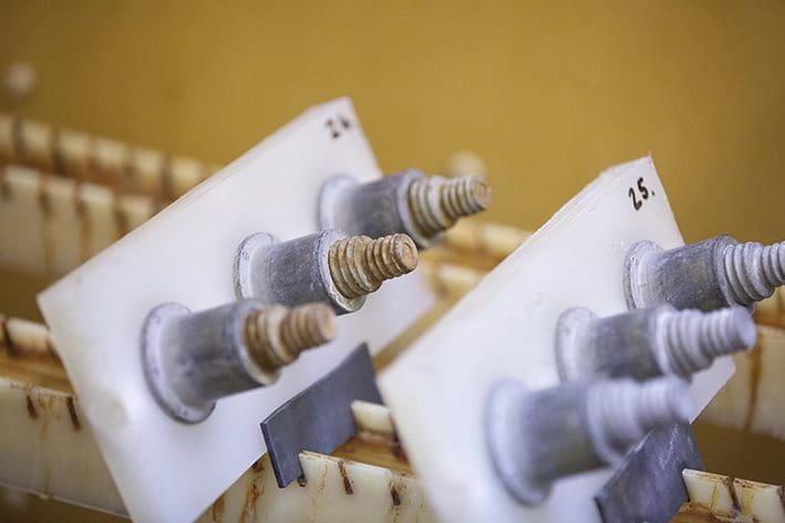 Bolts in a chamber for salt spray testing