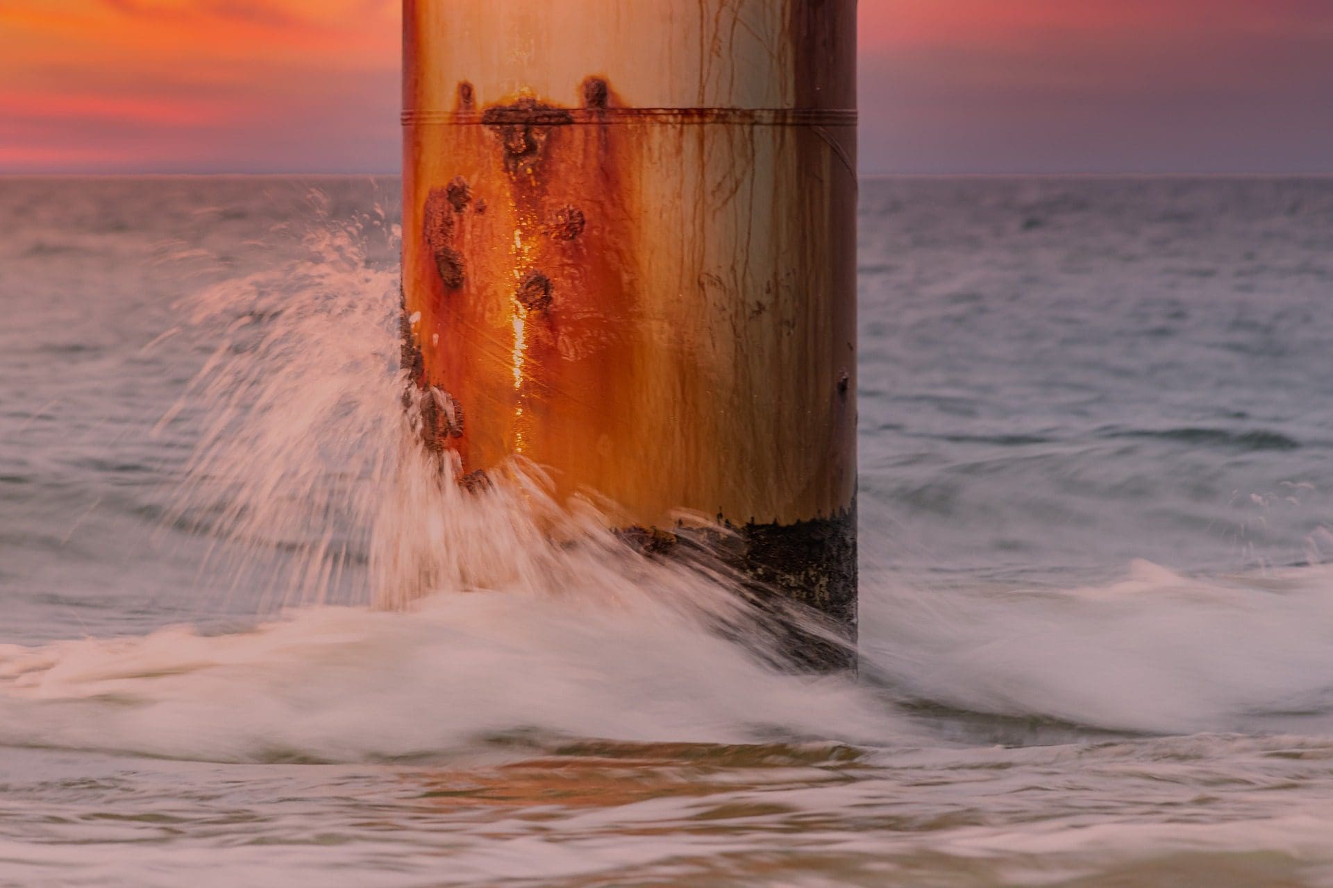 Corrosion damage on a large pipe with bolts in sea water